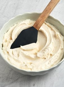 vanilla buttercream frosting in bowl with spatula