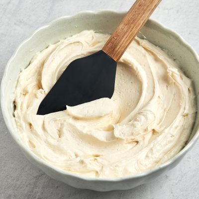 vanilla buttercream frosting in bowl with spatula