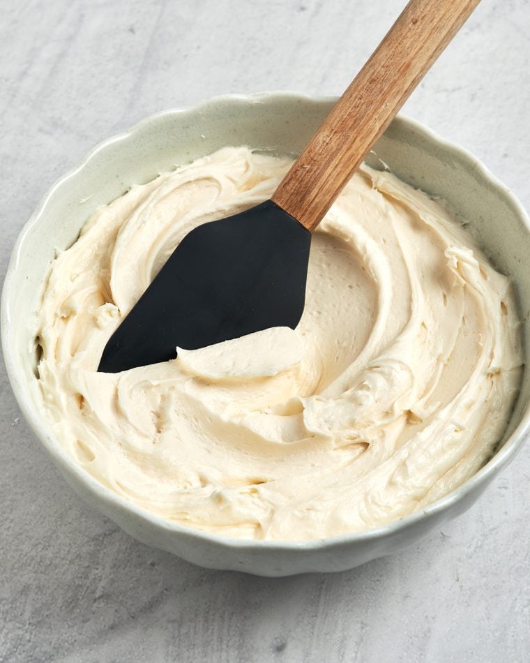 vanilla buttercream frosting in bowl with spatula
