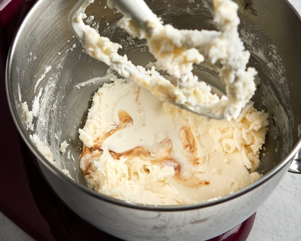 adding vanilla, cream, and salt to buttercream