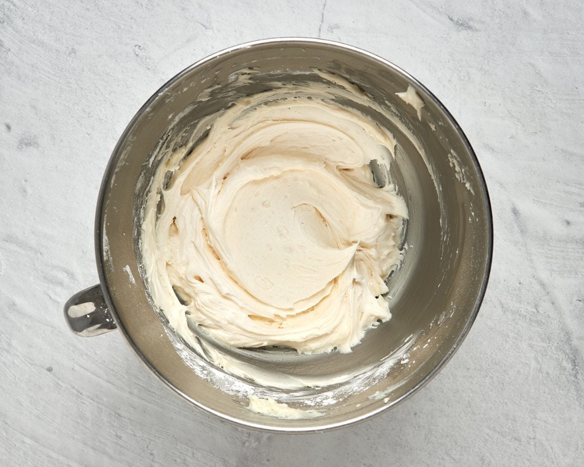 whipped vanilla buttercream in mixing bowl