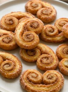 Palmiers on a white serving plate.