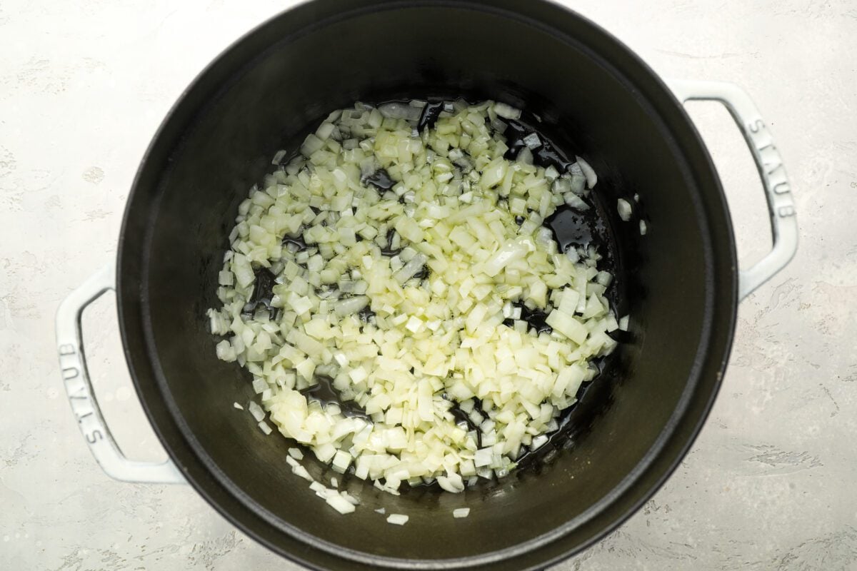 diced onion and garlic in dutch oven