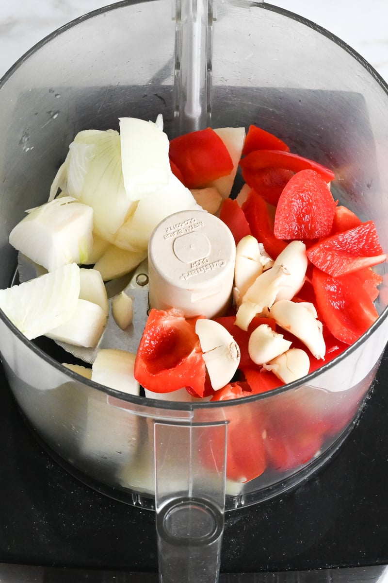 roughly chopped vegetables in bowl of food processor.