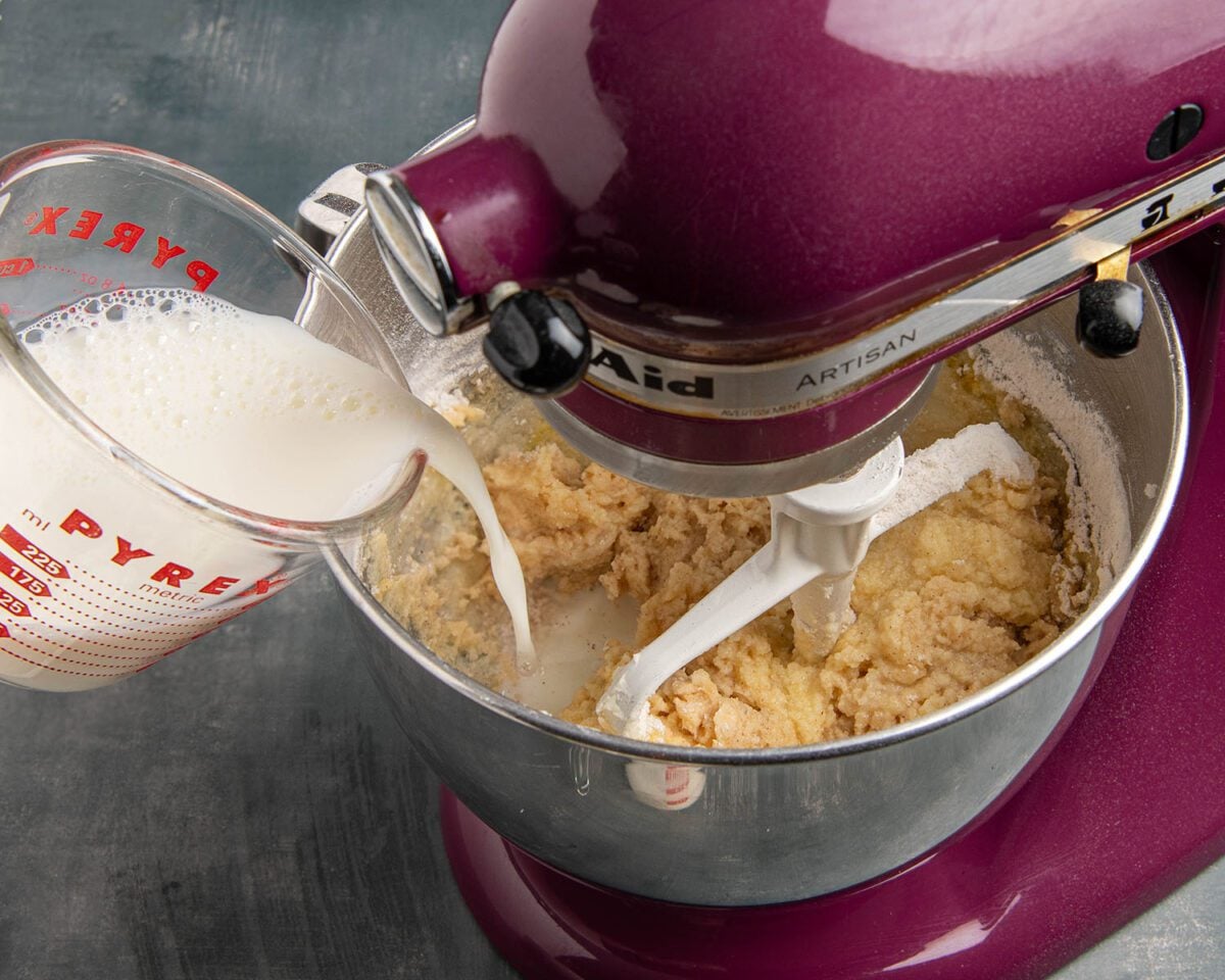 flour mixture and milk added to mixing bowl with butter/sugar/egg mixture