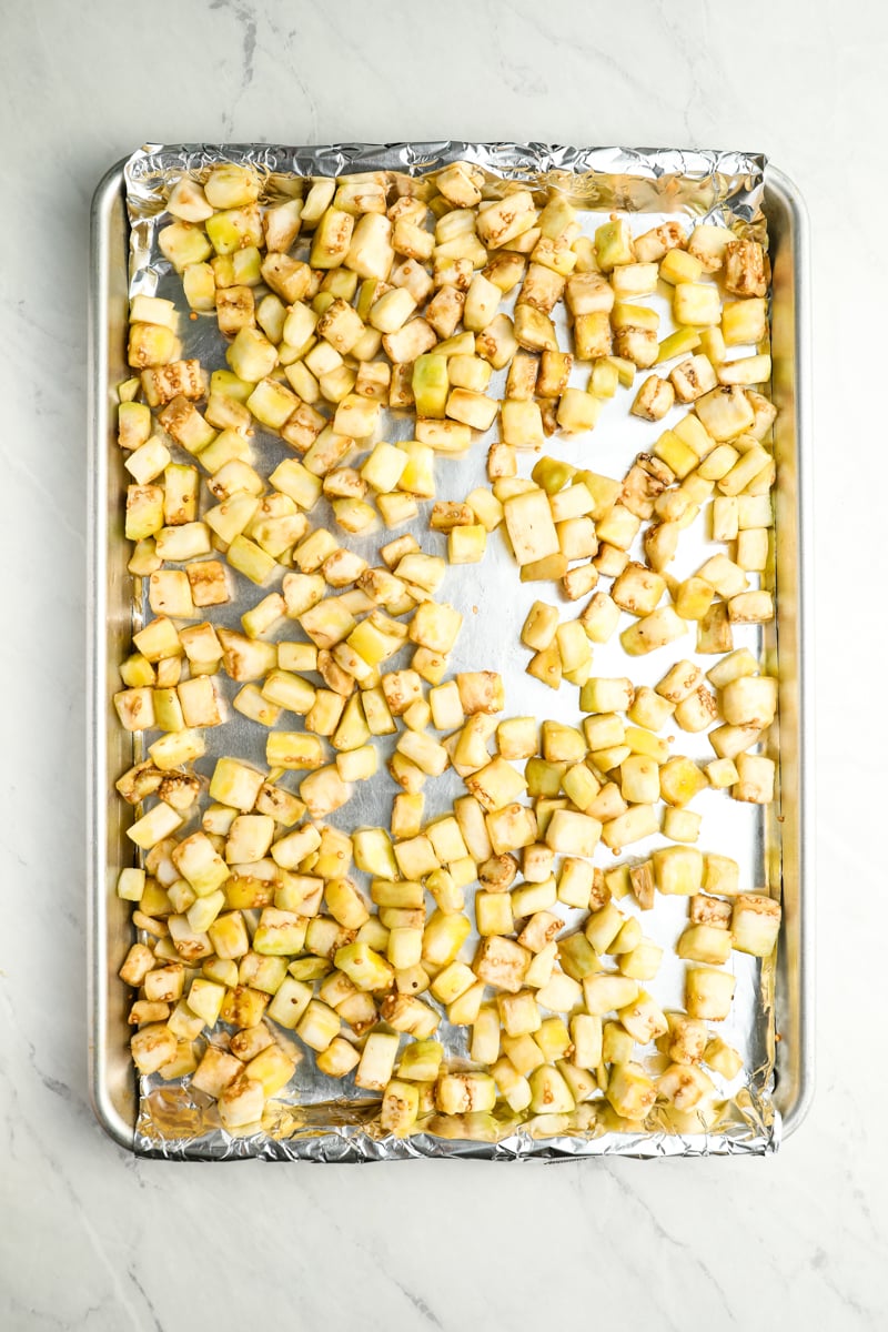 eggplant cubes in single layer on baking sheet