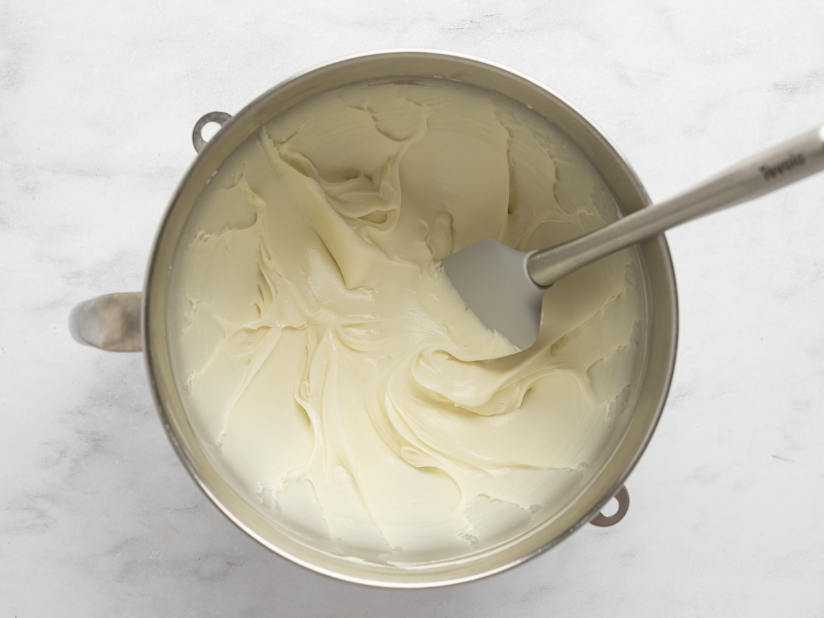 mixing bowl with frosting and spatula