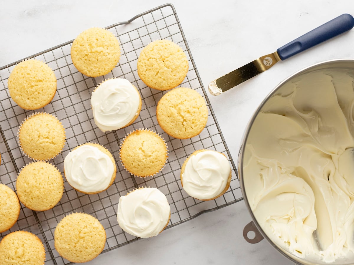 cupcakes on cooling rack with several cupcake frosted