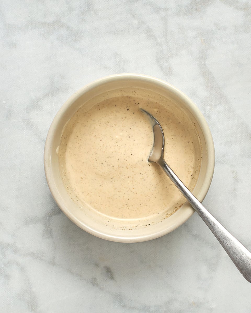 mayonnaise, mustard, lemon juice, salt, pepper, and garlic powder mixed in medium bowl