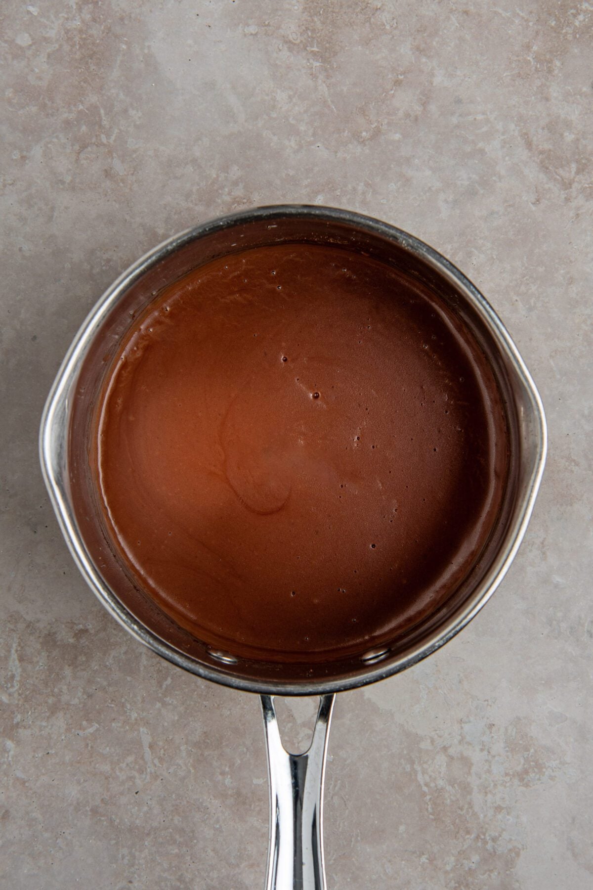 medium saucepan with mixture of butter, flour, cocoa powder, milk, liqueur (or additional milk), vanilla, and salt
