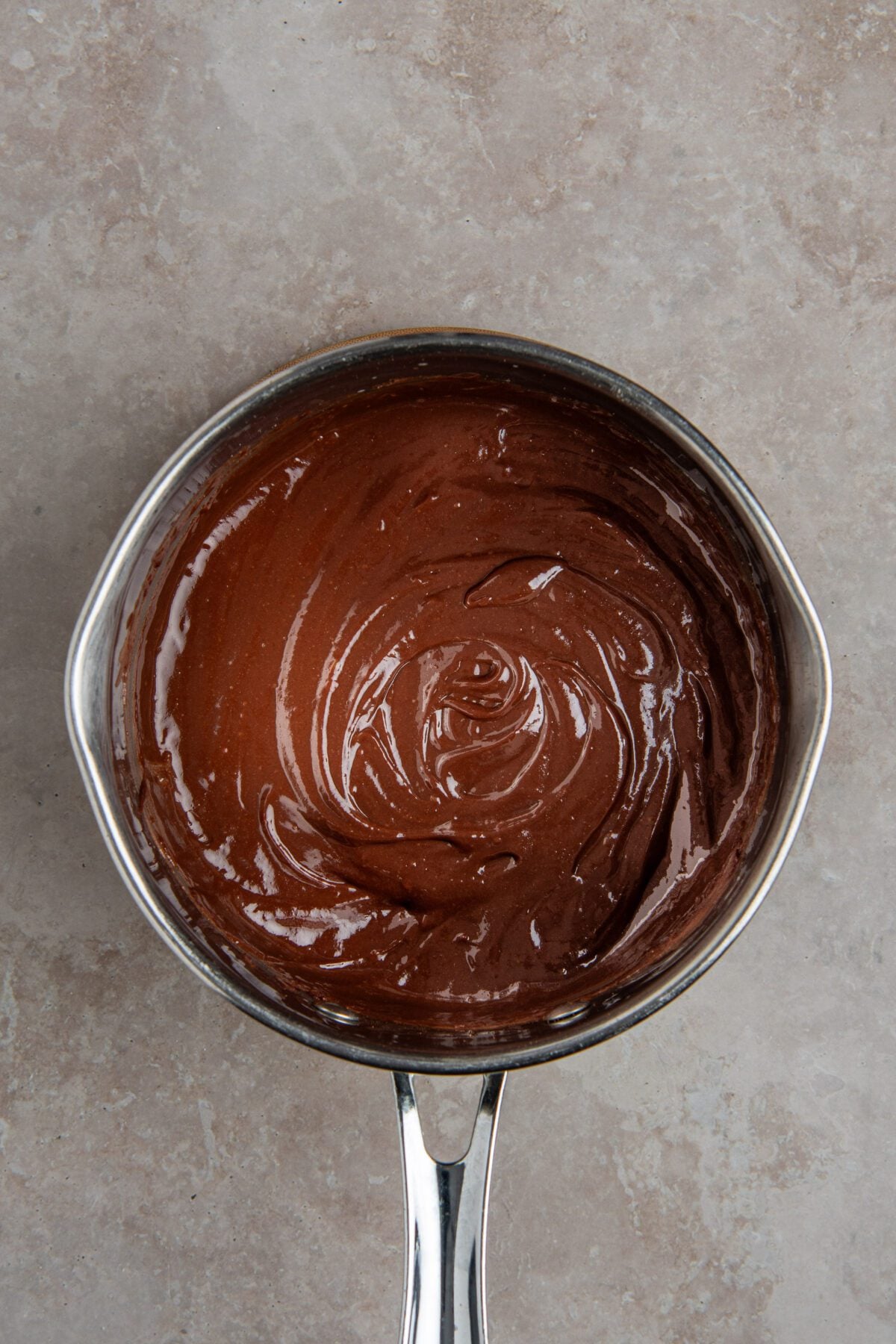 saucepan with melted chocolate and egg yolk mixture