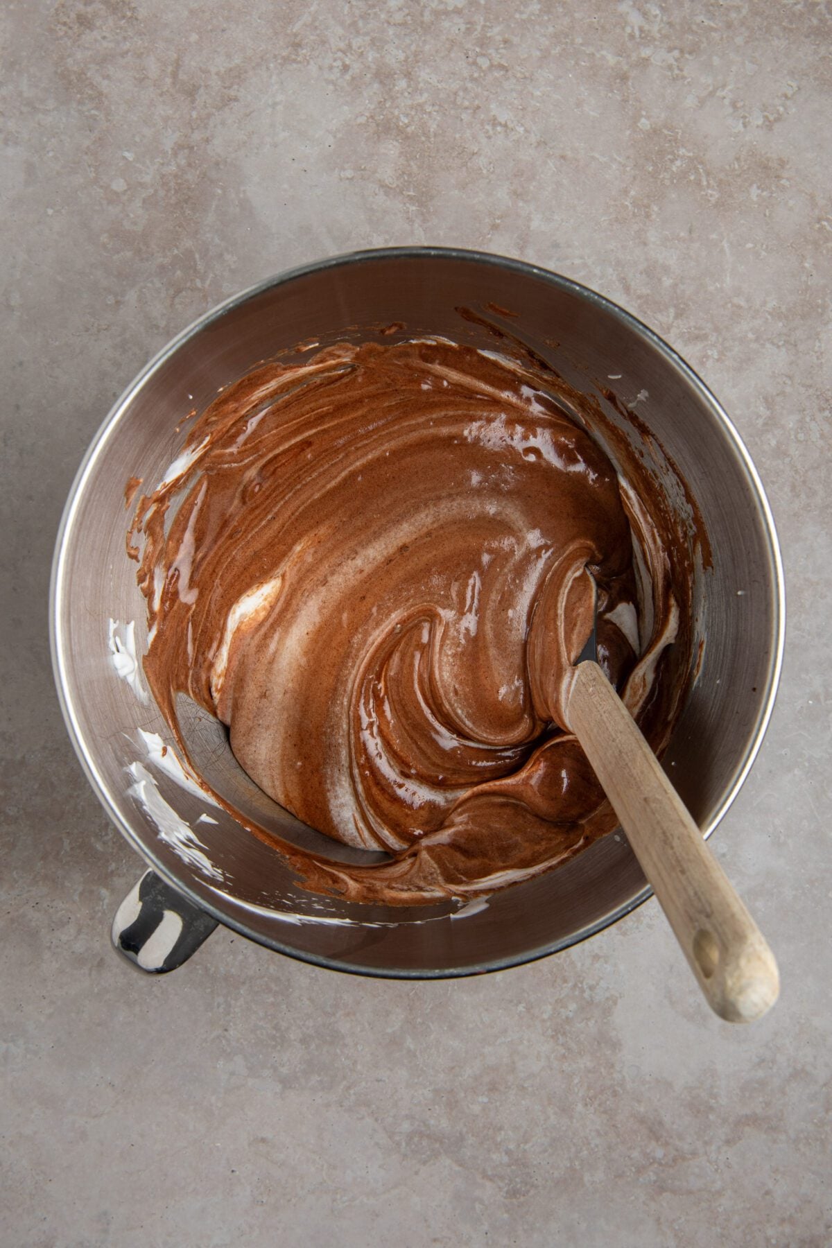 chocolate mixture folded into mixing bowl with egg white mixture