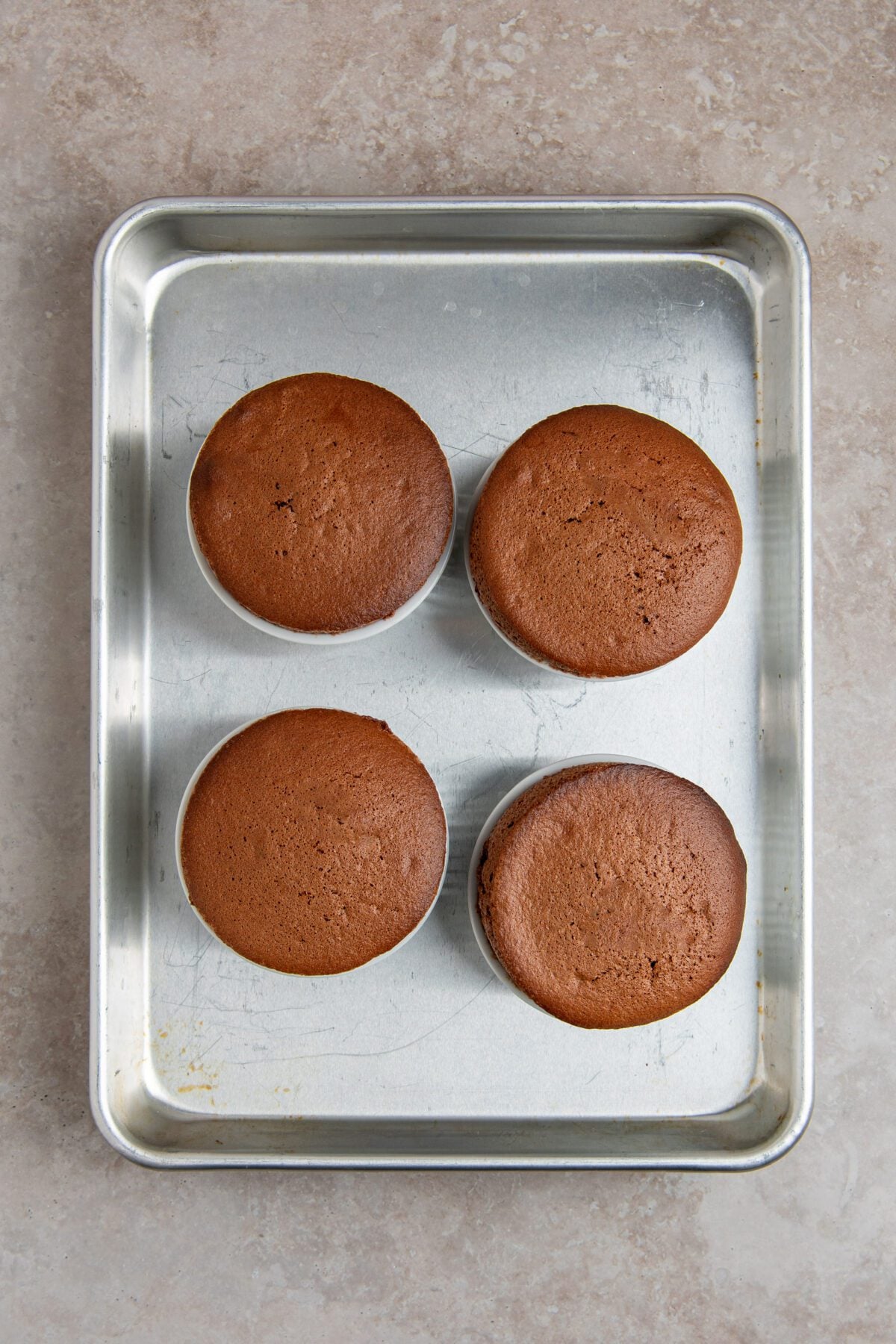 baked souffles on baking sheet