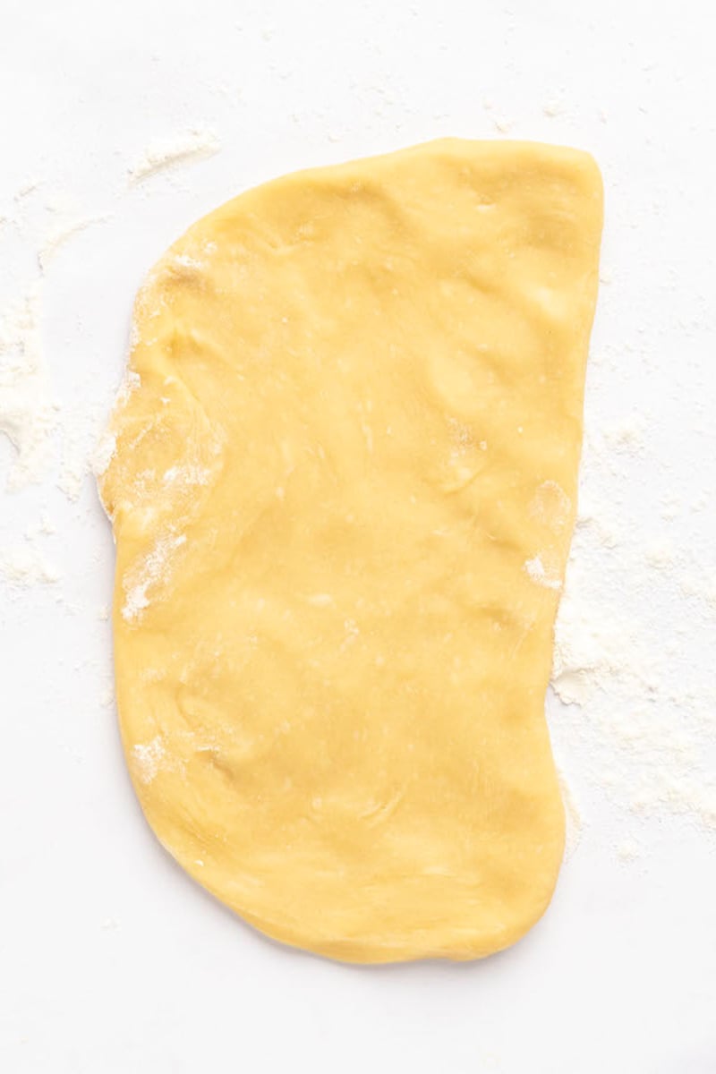 pasta dough flattened into rectangle.