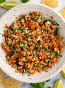 pico de gallo in white bowl with tortilla chips