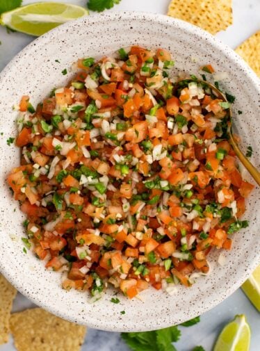 pico de gallo in white bowl with tortilla chips