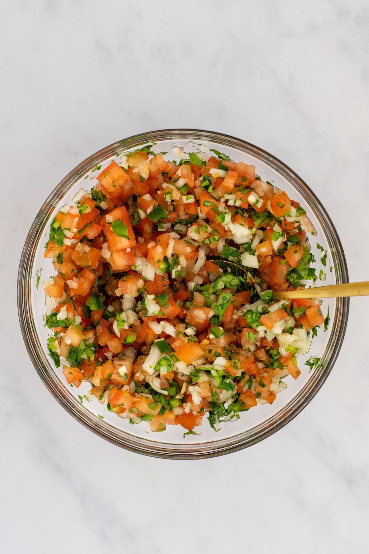 mixed pico de gallo in glass bowl
