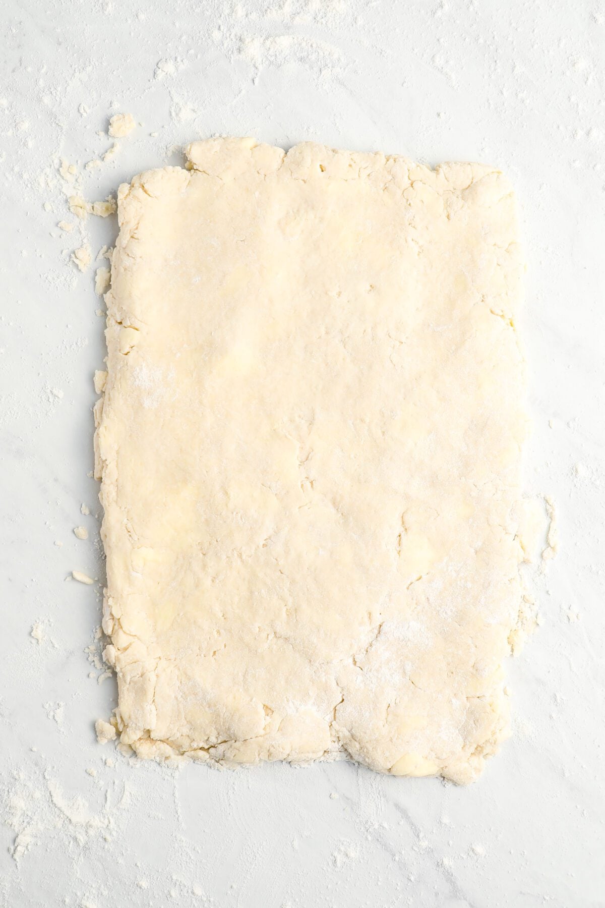 dough patted out into 3/4-inch rectangle on clean work surface