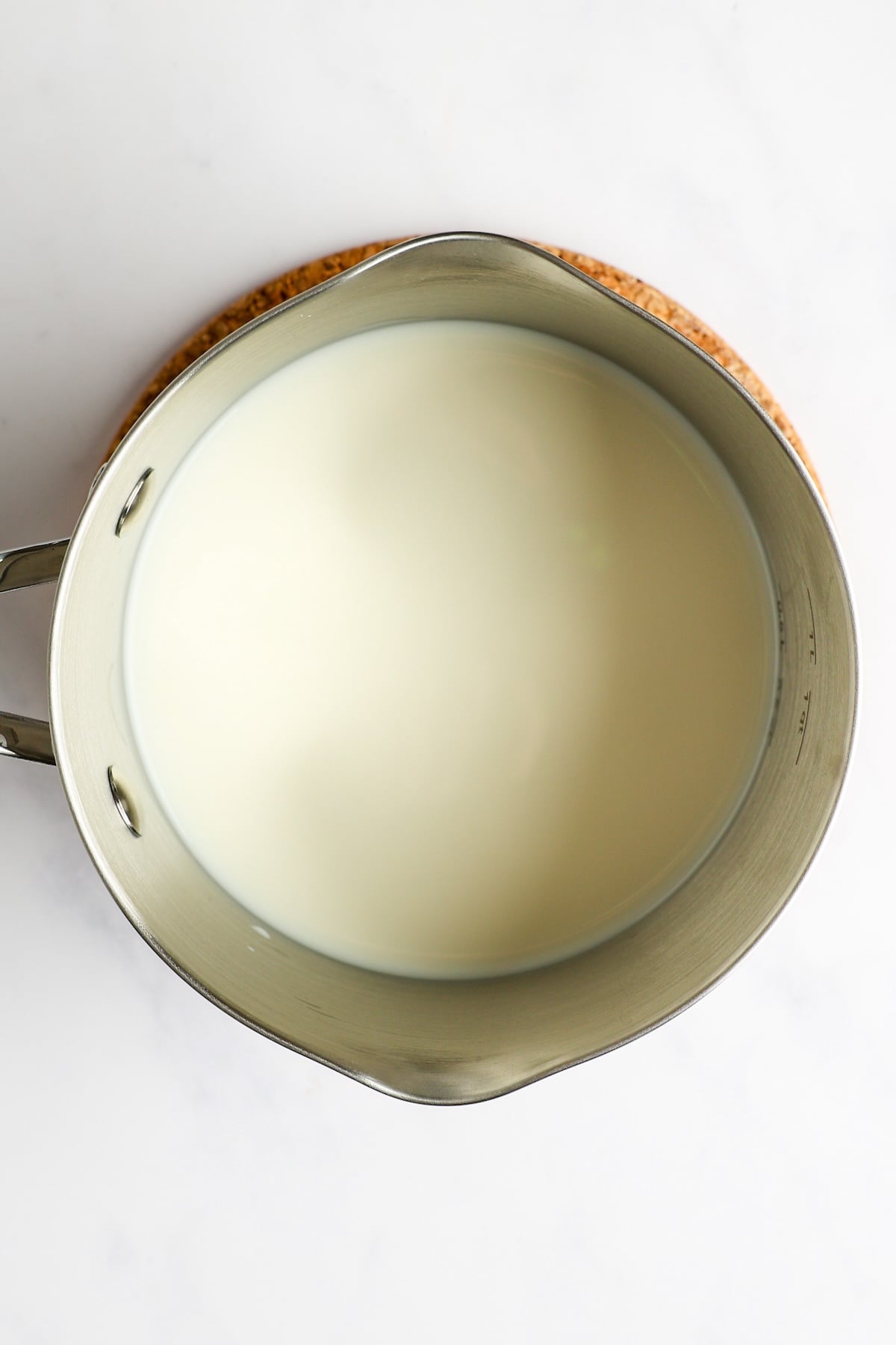 hot milk in medium saucepan