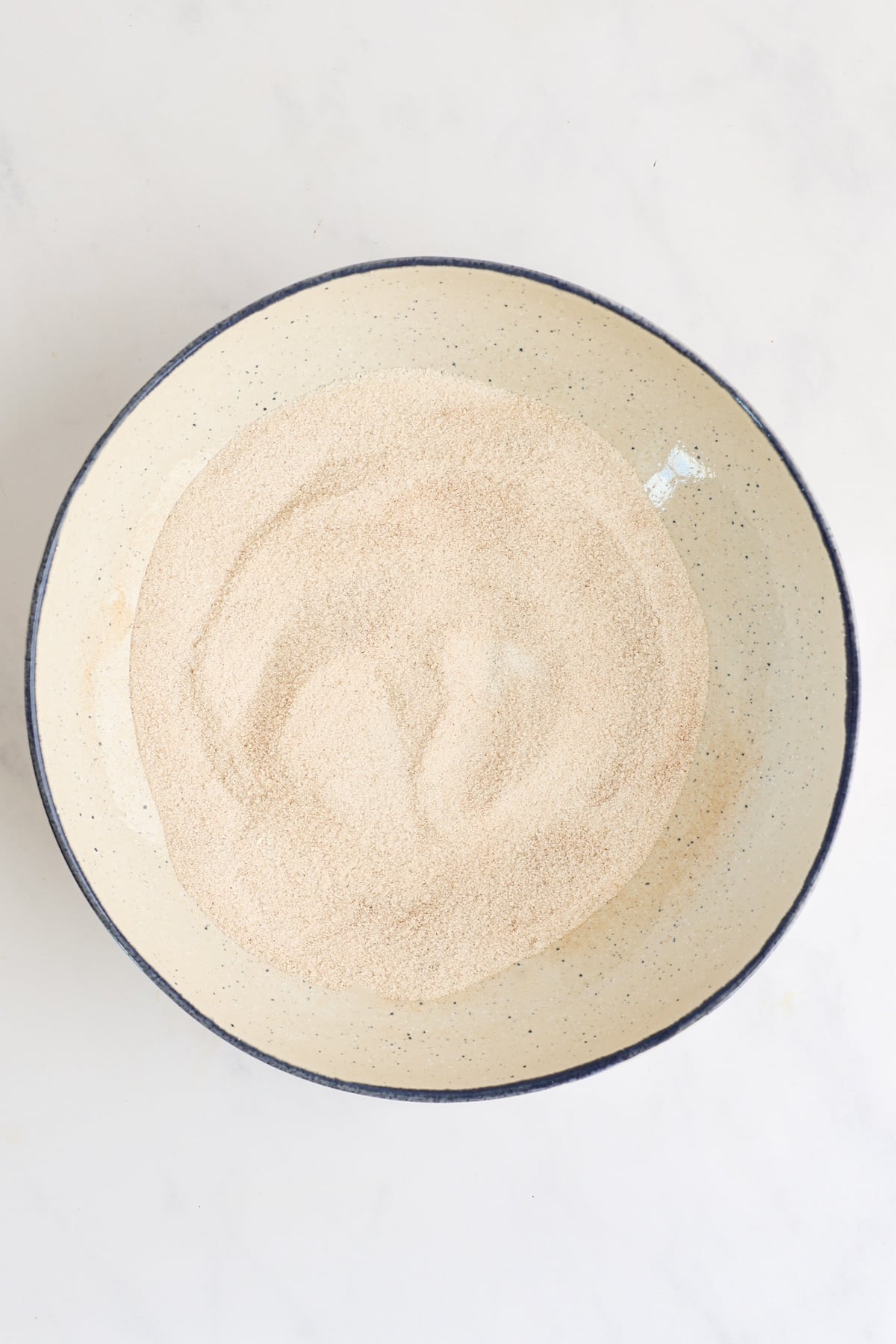 cinnamon and sugar combined in shallow dish