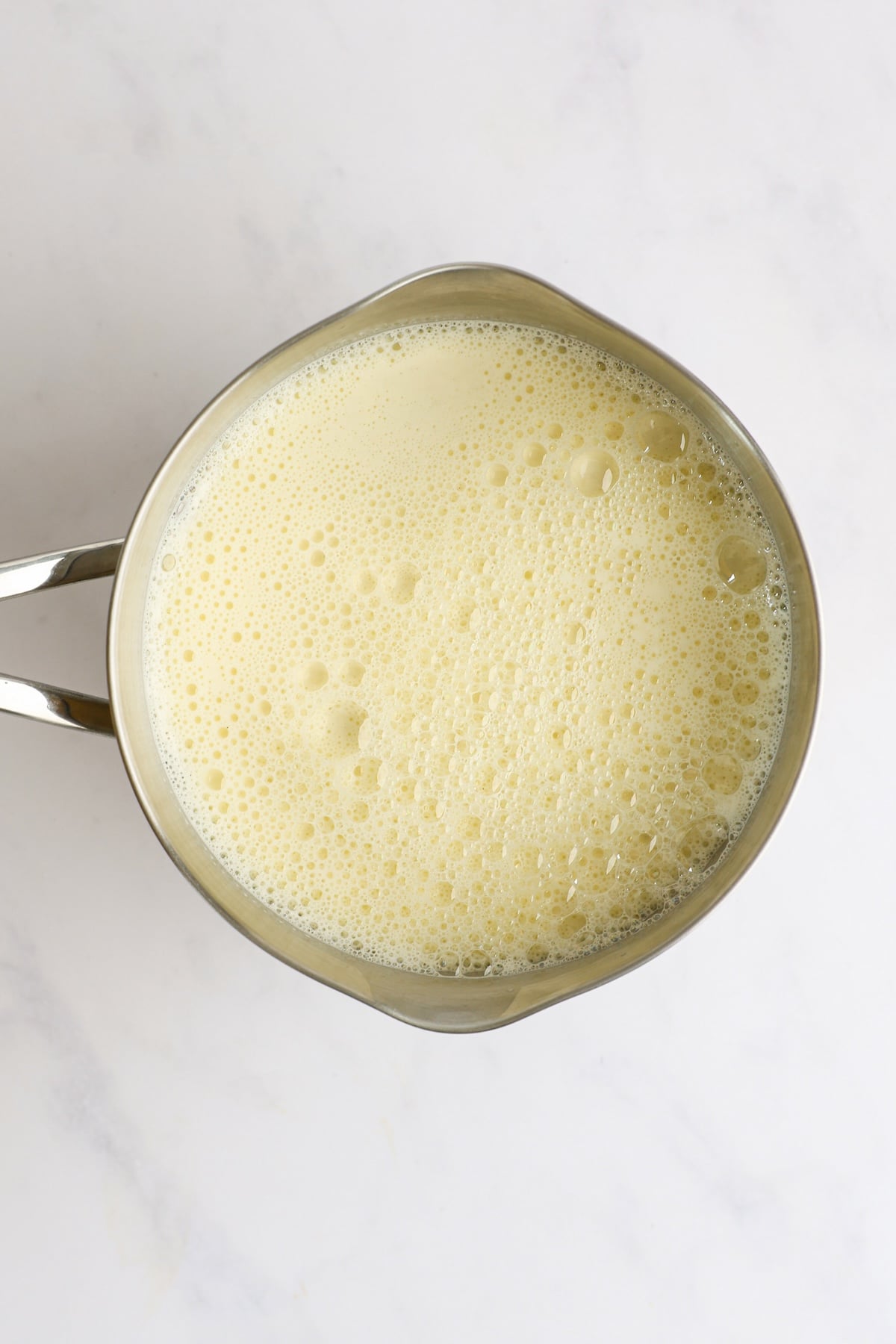 warm milk and sugar/egg mixture heating in saucepan