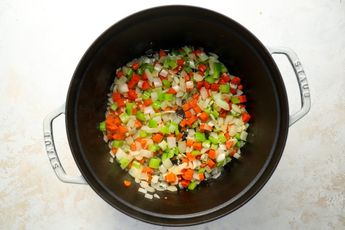 onion, celery, and carrots cooking in large dutch oven