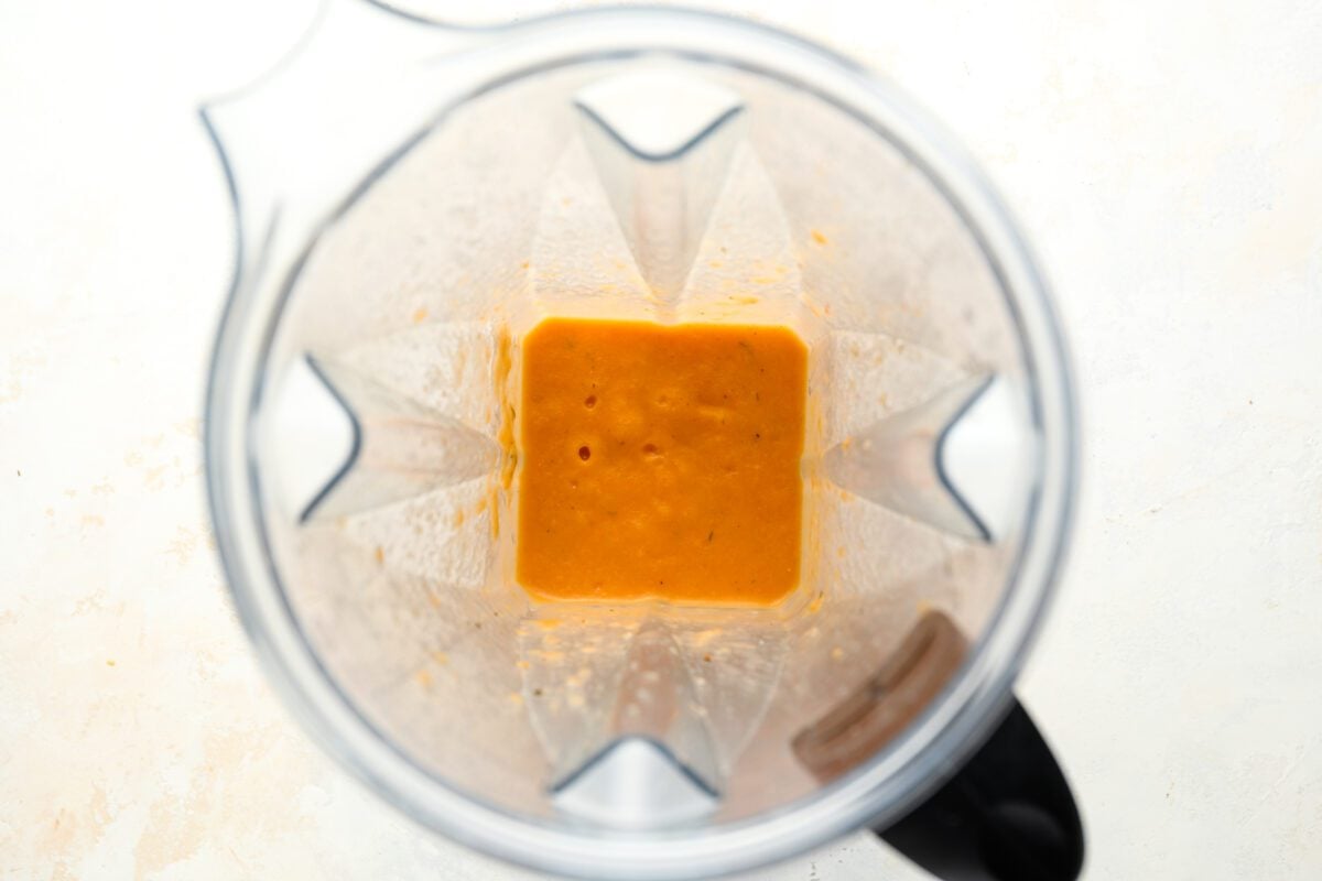 blender with blended beans, vegetables and broth