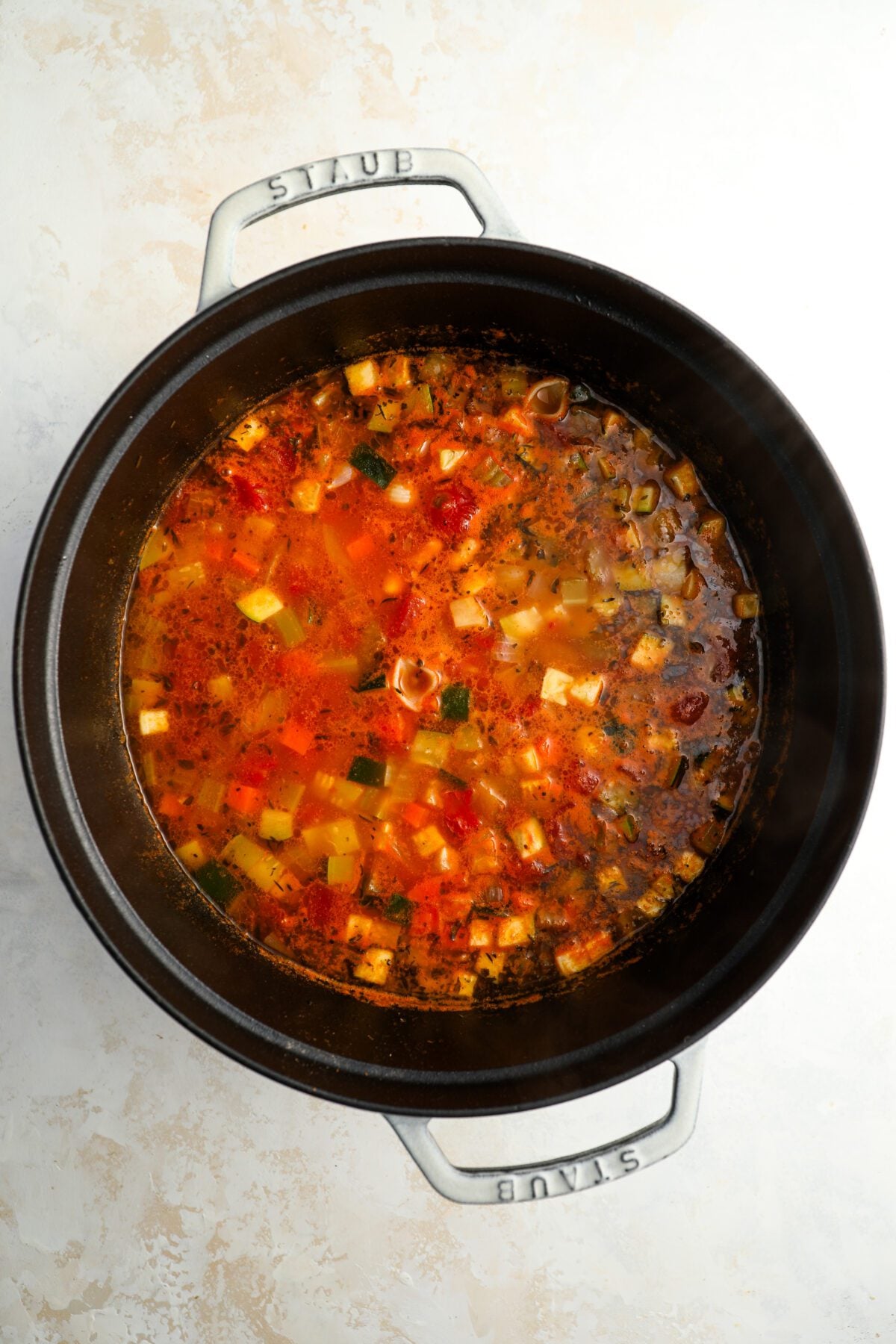 Dutch oven with reserved puree added to soup mixture