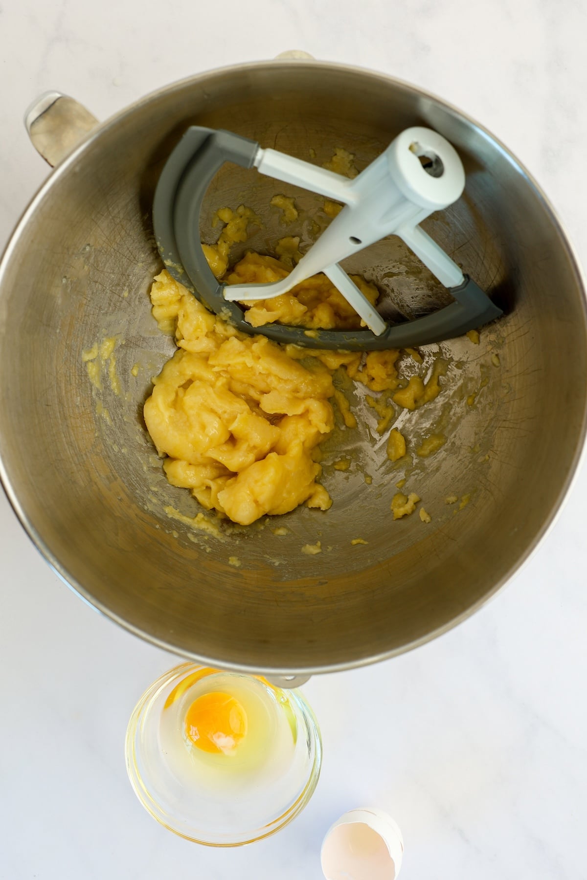 dough in mixing bowl with eggs mixed in