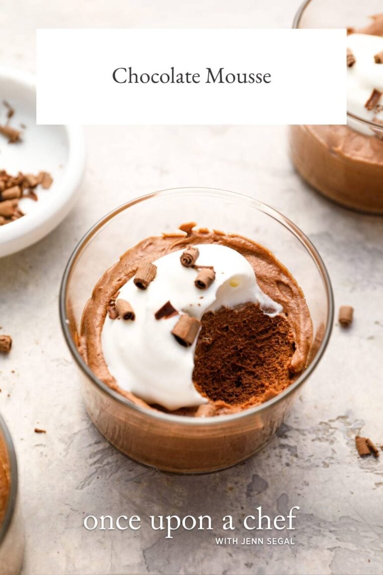 small glass with chocolate mousse topped with whipped cream and chocolate shavings