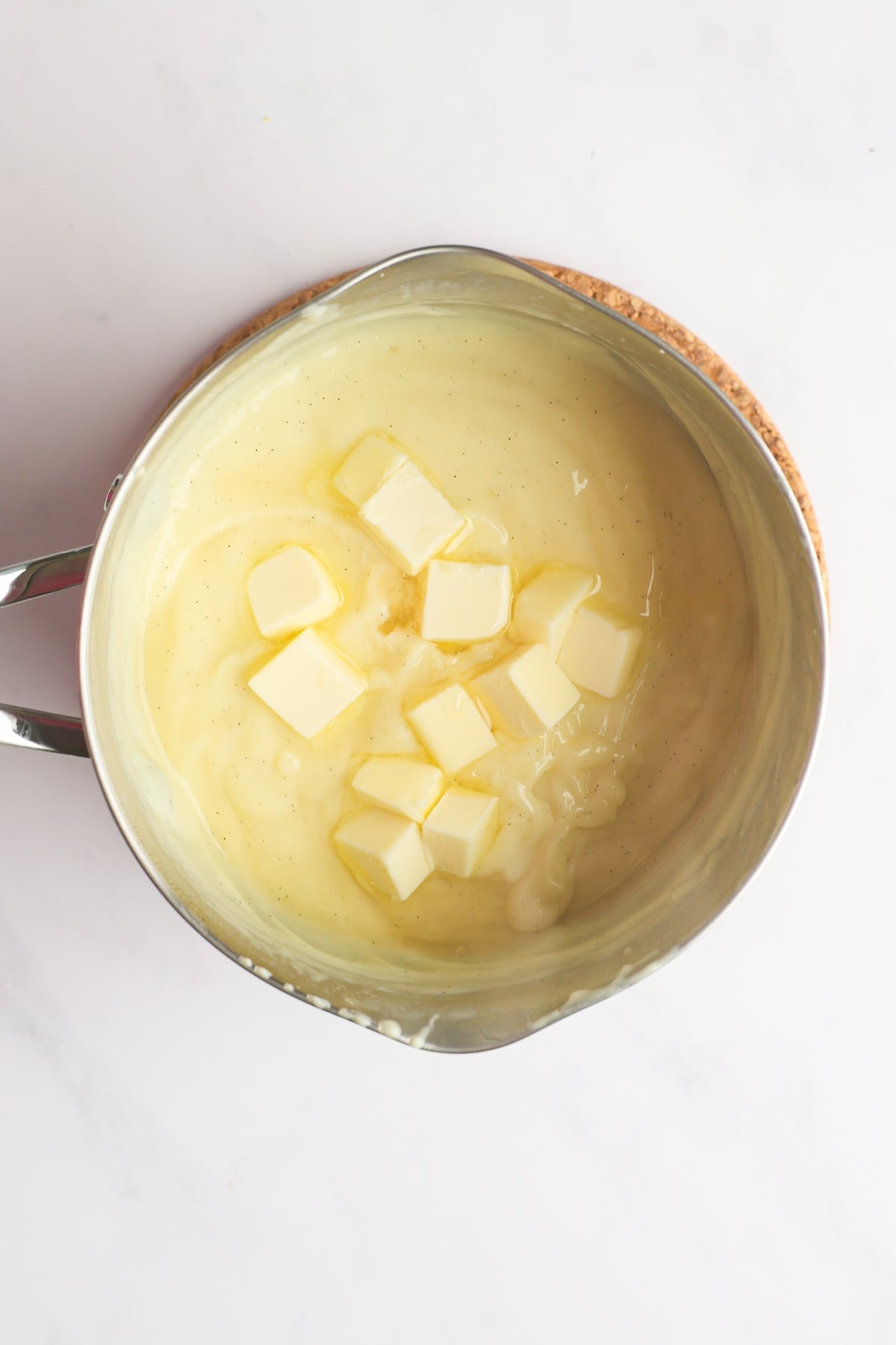adding butter to pastry cream