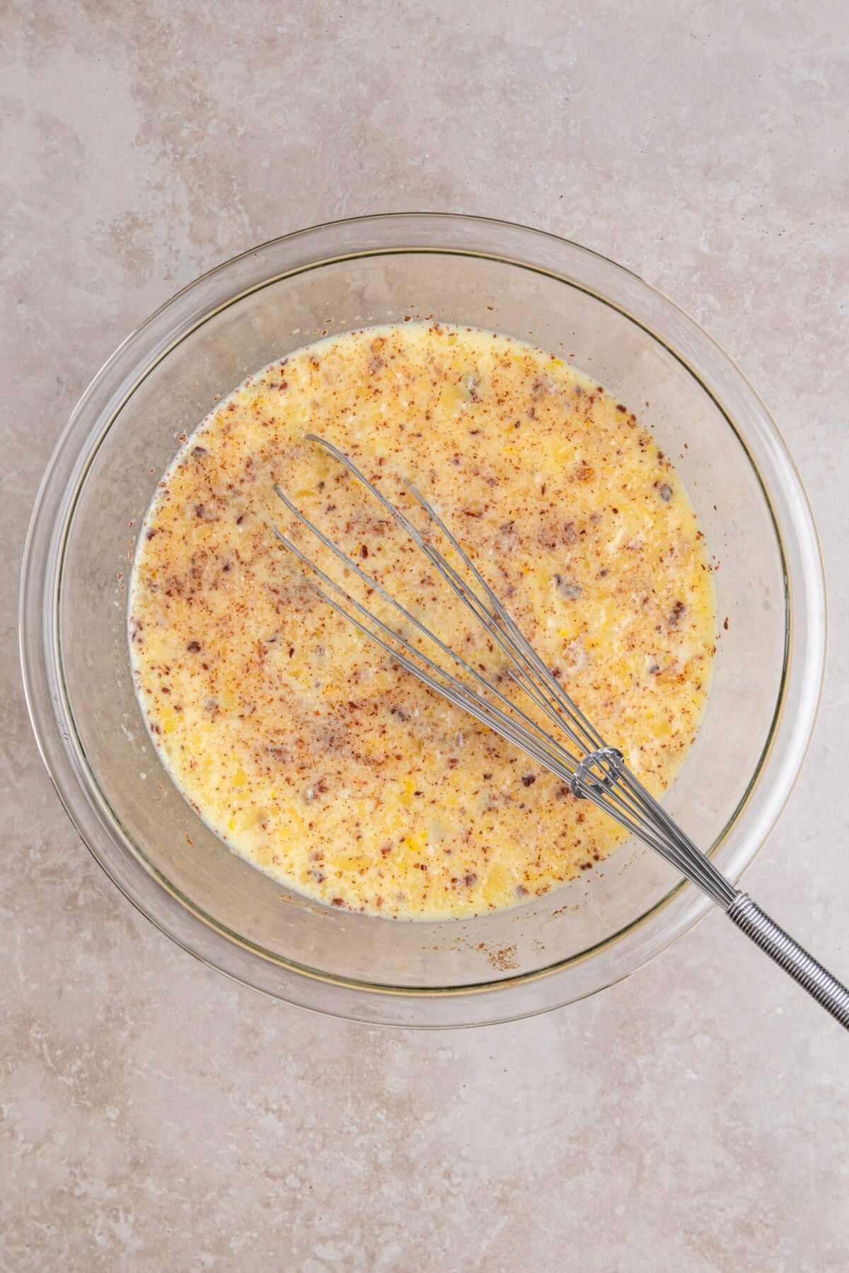 whisked bread pudding custard ingredients in bowl