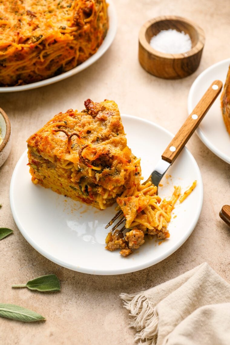 A wedge of spaghetti pie on a plate.