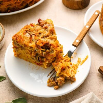 A wedge of spaghetti pie on a plate.