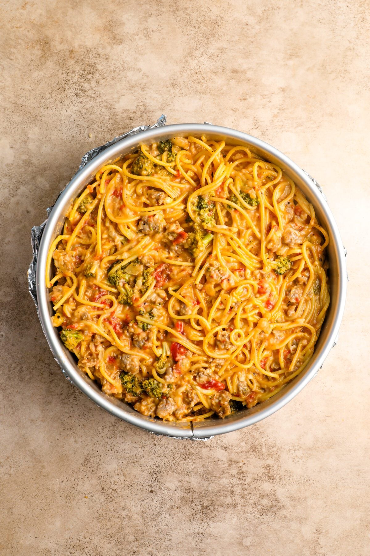spaghetti pie mixture in springform pan