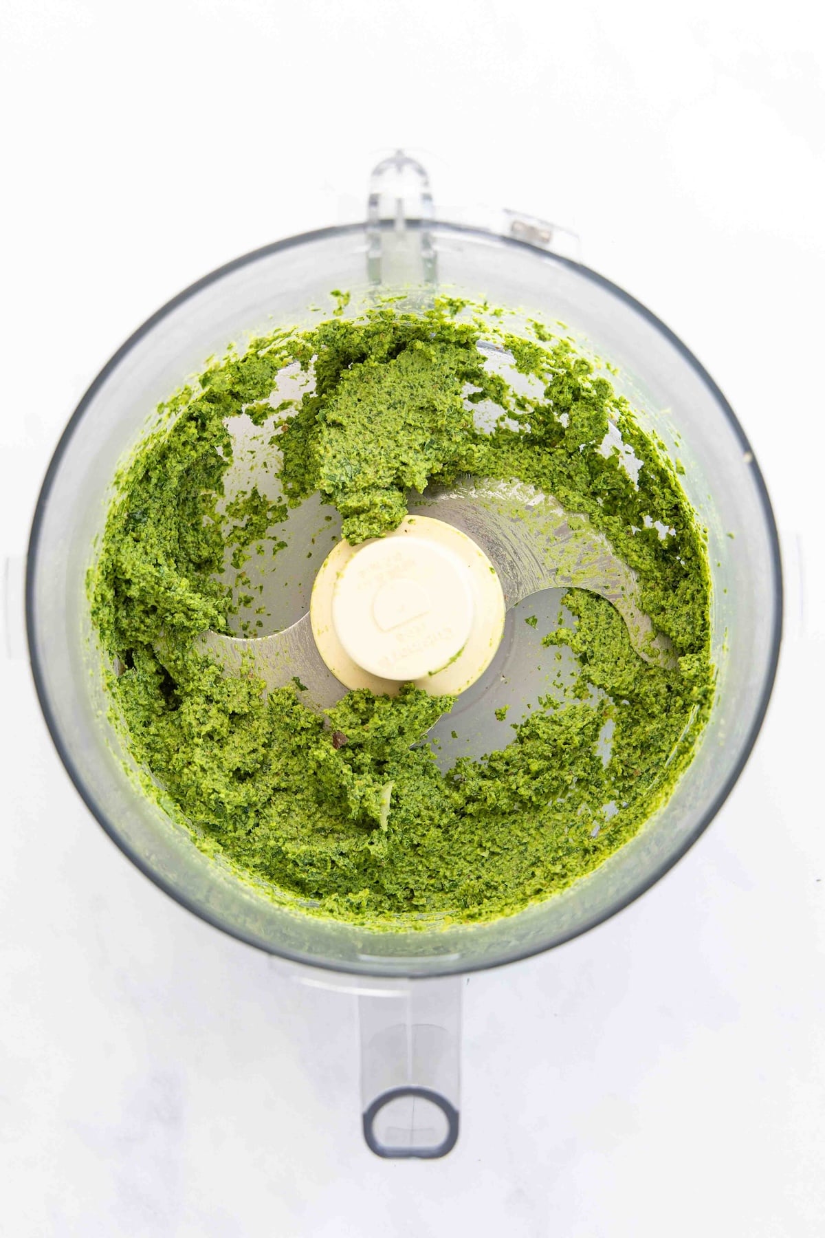 finely chopped basil and nuts in food processor
