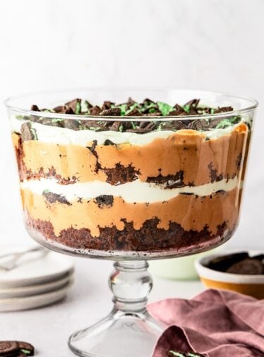 Chocolate mint trile in trifle dish with chocolate mint cookies nearby
