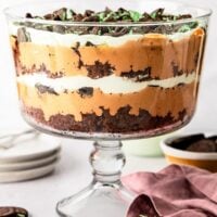 Chocolate mint trile in trifle dish with chocolate mint cookies nearby