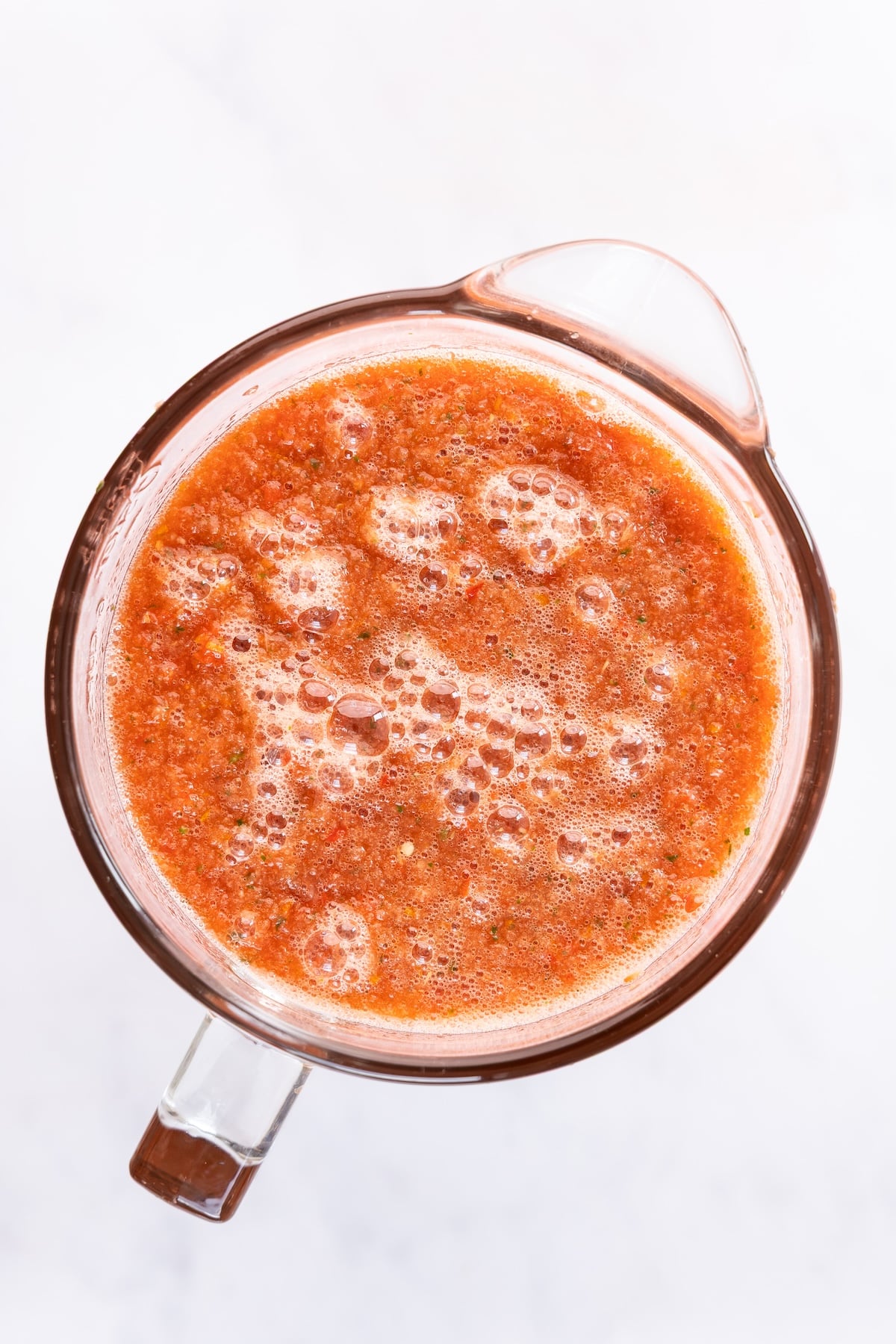 blender with blended watermelon gazpacho ingredients