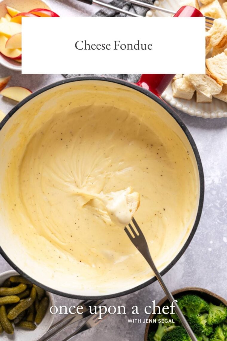 Dipping bread cube into cheese fondue