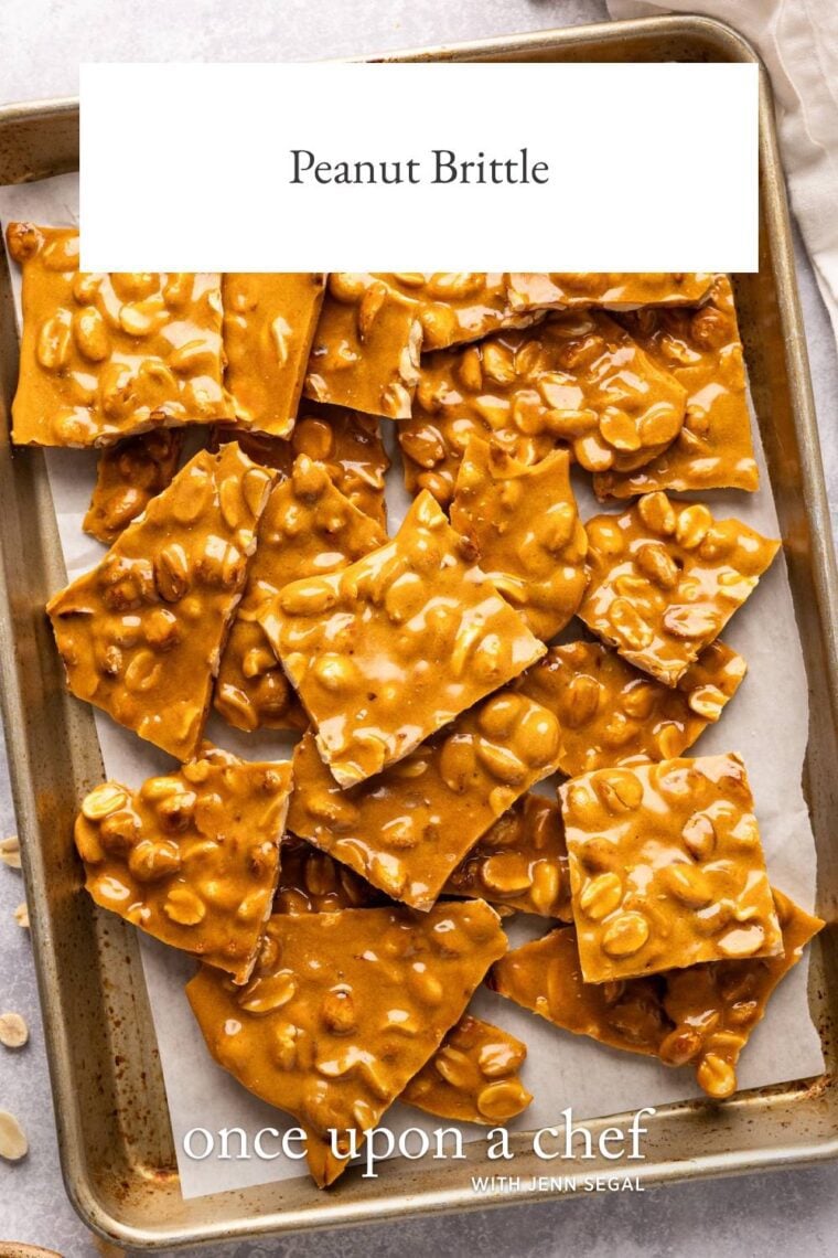 pieces of peanut brittle on parchment lined baking sheet