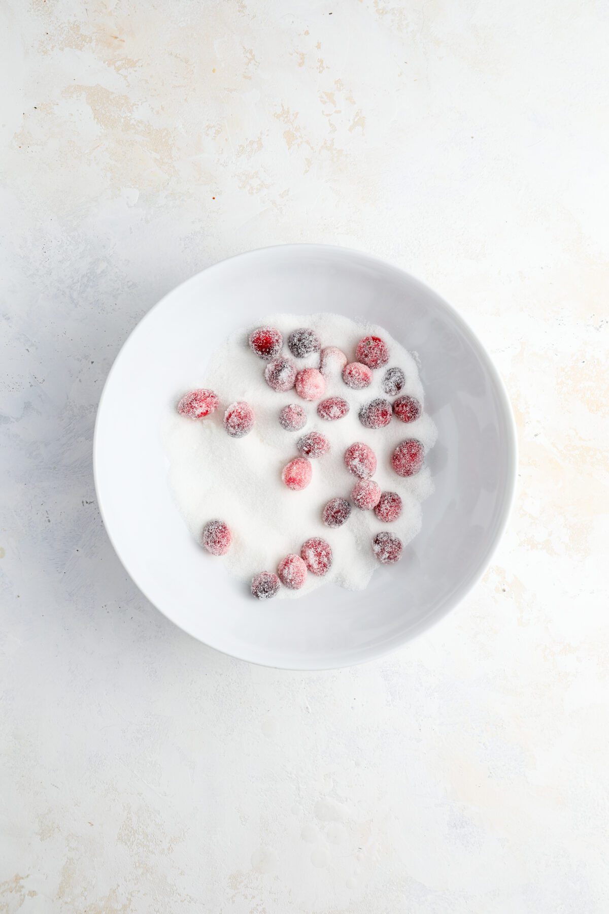 small bowl with granulated sugar and cranberries