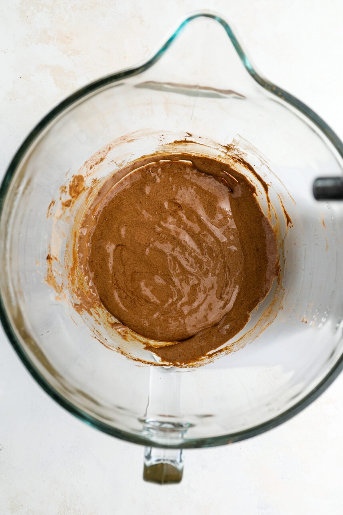 mixing bowl with cocoa powder, vanilla, and salt combined with egg yolk/sugar mixture