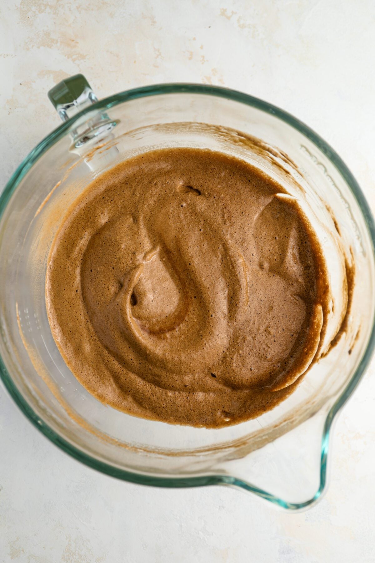 combining the egg yolk mixture and beaten egg whites