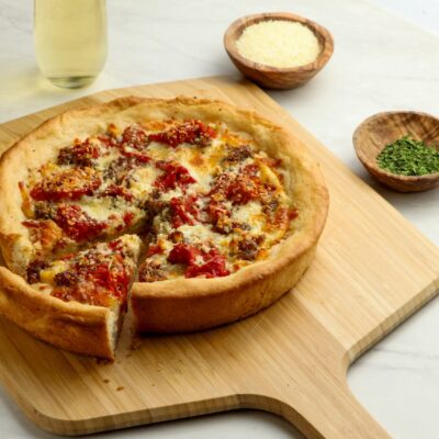 deep dish pizza on cutting board