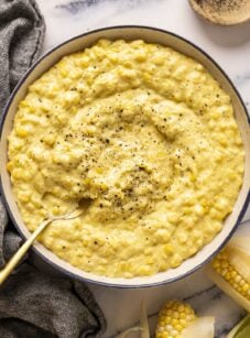creamed corn in bowl with fresh black pepper