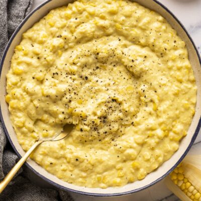 creamed corn in bowl with fresh black pepper