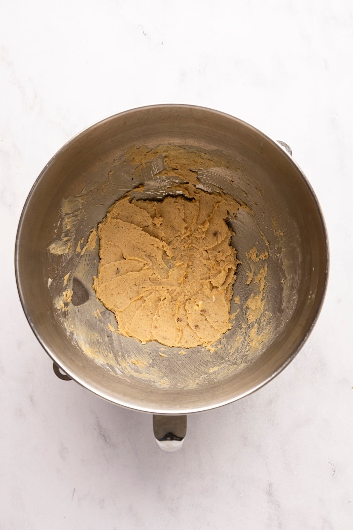 mixing bowl with butter, granulated sugar, confectioners' sugar, vanilla, and salt combined together