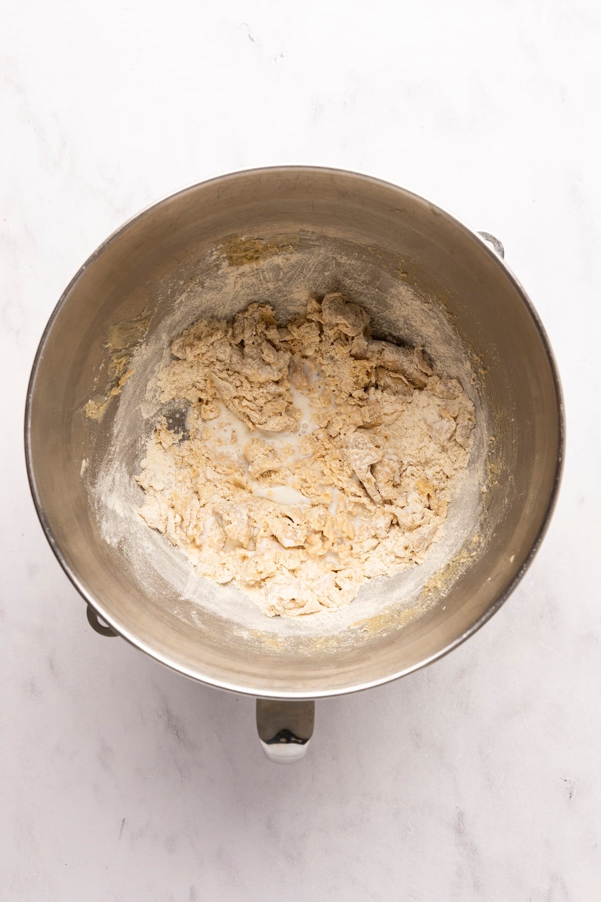 mixing bowl with toasted flour added to butter/sugar mixture