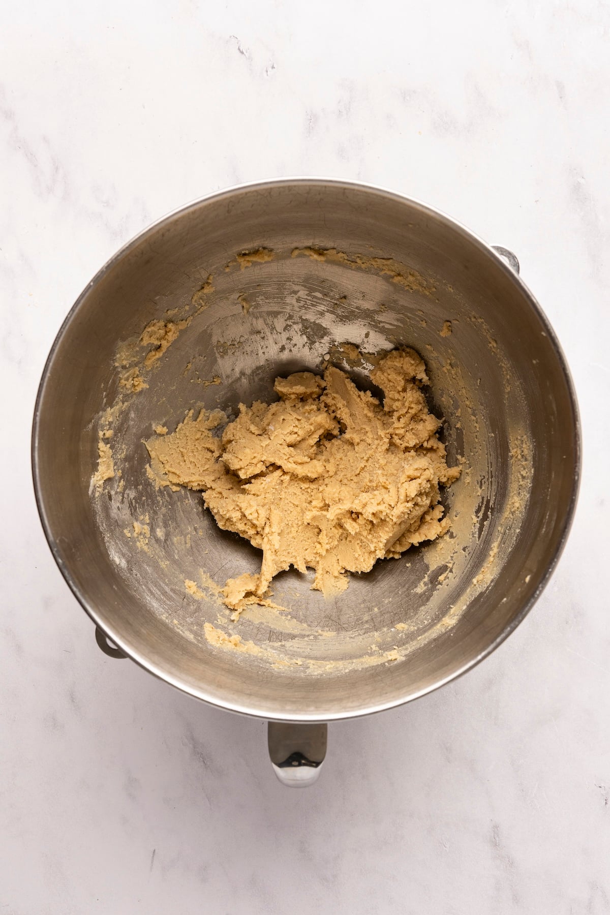 mixing bowl with cream incorporated into flour/butter/sugar mixture
